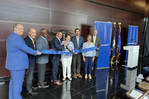 Economic development stakeholders cutting ribbon at the Lockheed Martin Coldstream Research Campus ribbon cutting